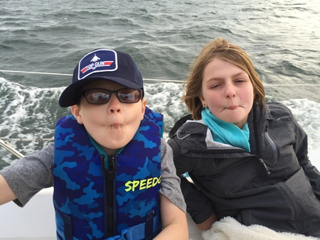 Olivia and Trevor's fish faces while out sailing!