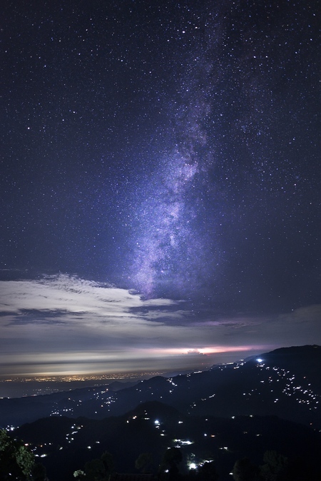 lightning under milky way