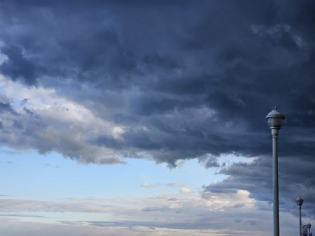 A sunny day to a stormy night, with the lamppost as the witness.