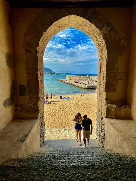 Through the arch,  beach  scene Cefalu,  Sicily 