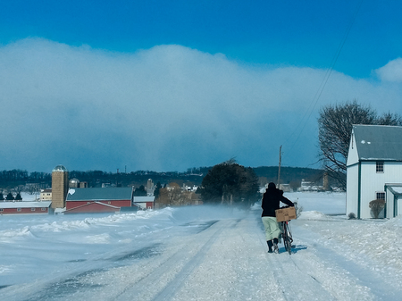 Bicyclist in Snow Squall