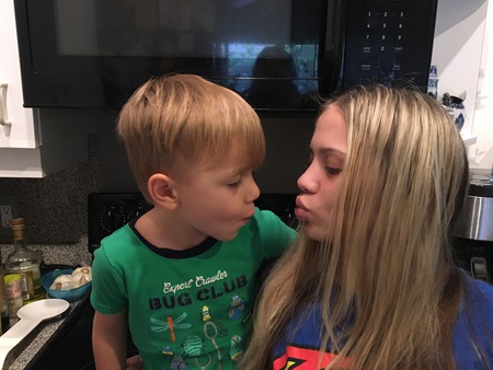 N teaching her brother fishy face 