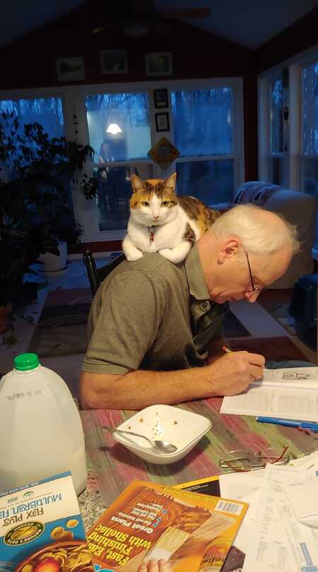 Entry image for Camille, Daddy's girl. Likes to assist with his reading or puzzling. . Clicking this image will show a larger photo